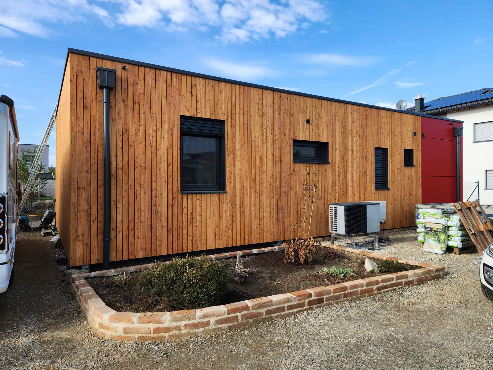 RMB Modul 125 – XXX hiša L‑oblike, Königsbrunn am Wagram – lesena modularna hiša v L obliki po meri